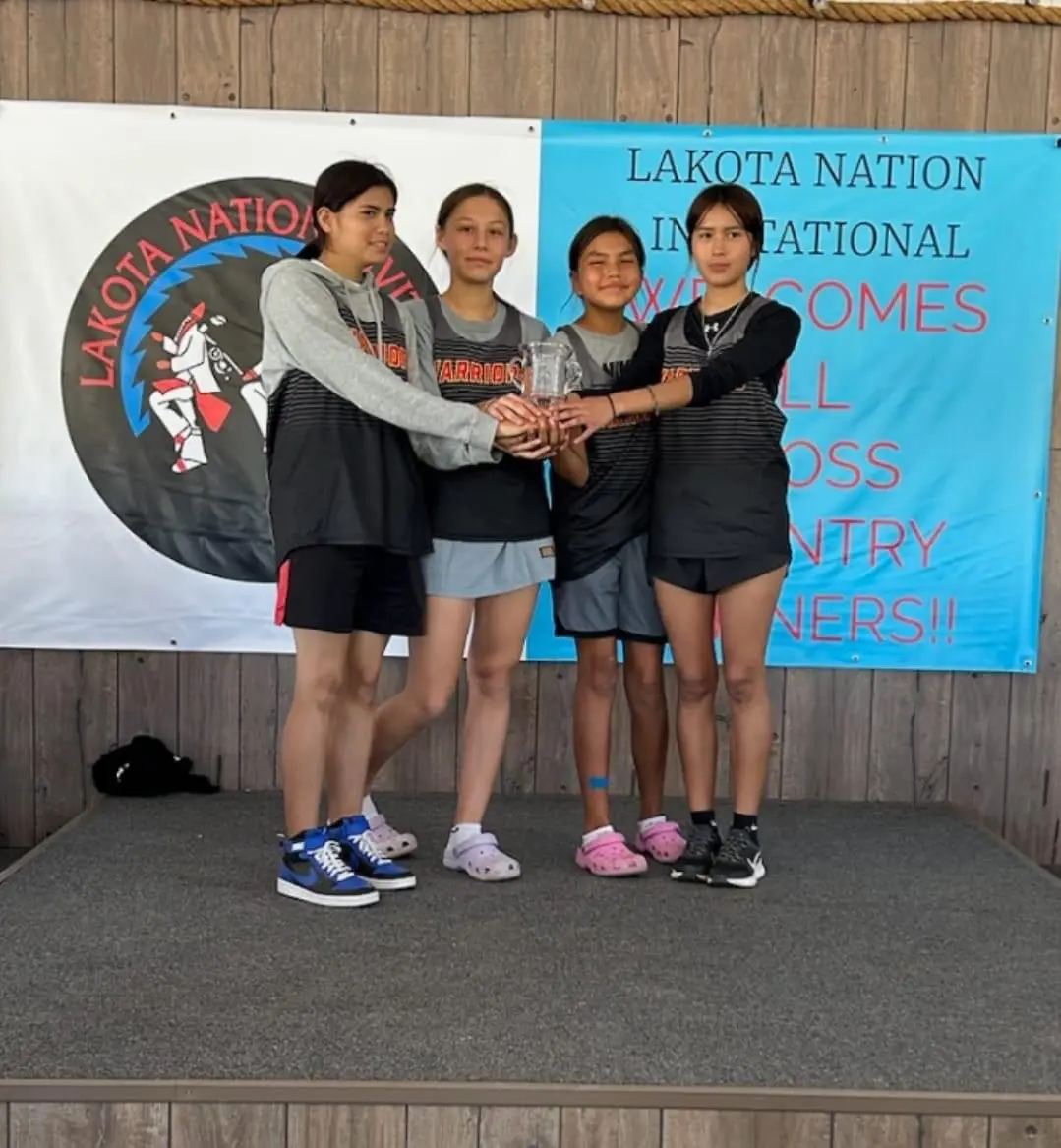 Athletes holding a trophy