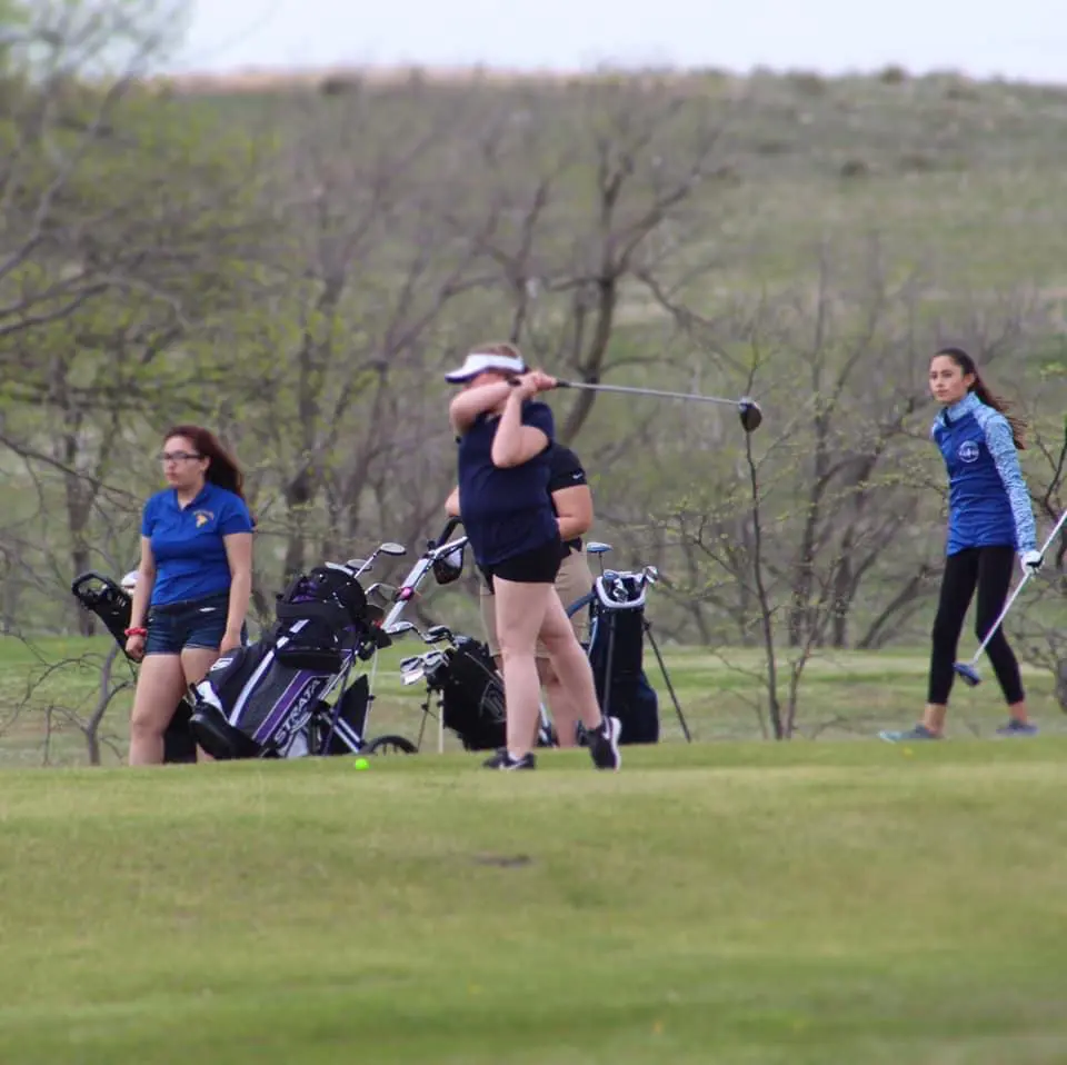 Golfer with a follow-through golf swing
